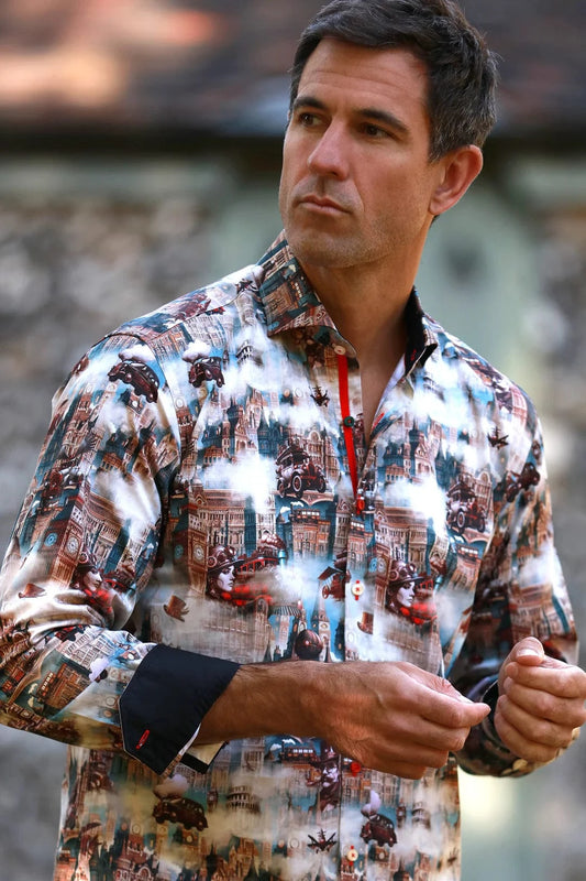 A man wearing a Claudio Lugli steampunk city print shirt with a blend of vintage architecture and mechanical elements, in a satin-cotton fabric.