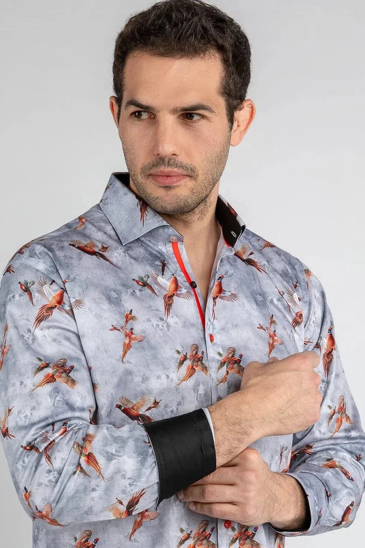 A man wearing a Claudio Lugli shirt with a pheasants flying print.