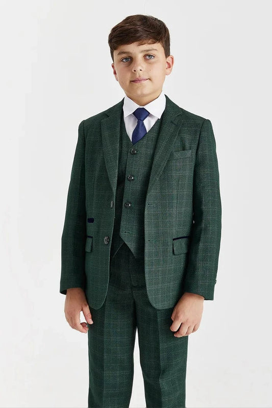 Young boy wearing a Paul Andrew Leo green check tweed suit with a white shirt and blue tie, perfect for weddings or formal events, on a white background.