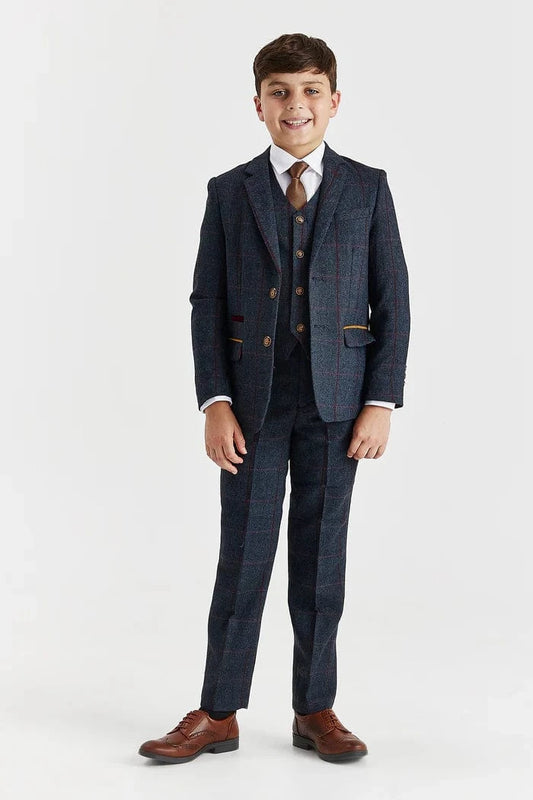 Young boy wearing a Paul Andrew Madrid navy tweed formal suit with a brown tie, perfect for weddings and matching father and son outfits, on a white background.
