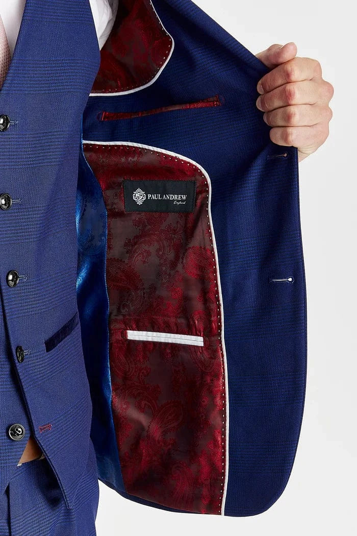 Blue suit jacket with red lining and 'Palm Beach' label on a white background