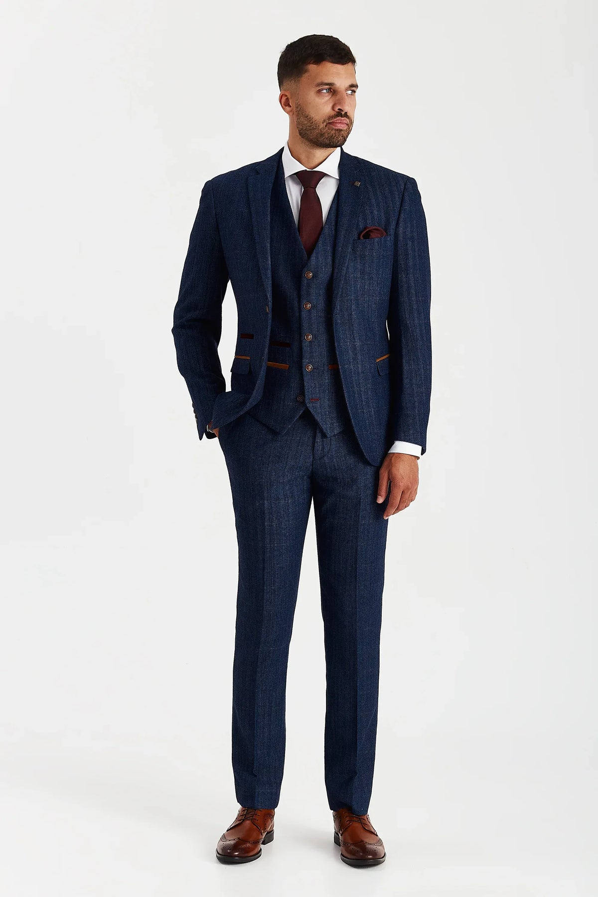 Male model wearing the Paul Andrew Scott Navy Tweed Check Three Piece men’s suit from Menz Suits Stockport, featuring navy tweed fabric and tailored fit design.