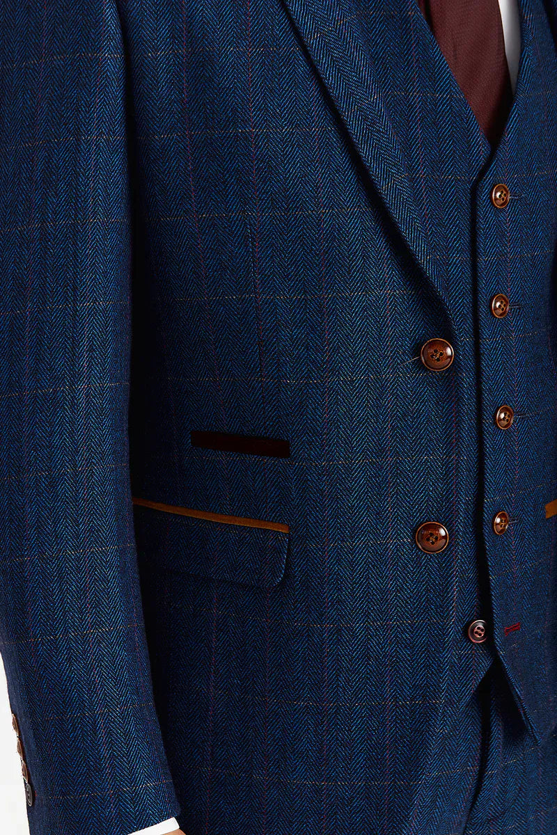 Close-up of the Paul Andrew Scott Navy Tweed Check men’s suit jacket from Menz Suits Stockport, showing textured tweed fabric, tan and burgundy check pattern, brown buttons, and tan suede detailing.