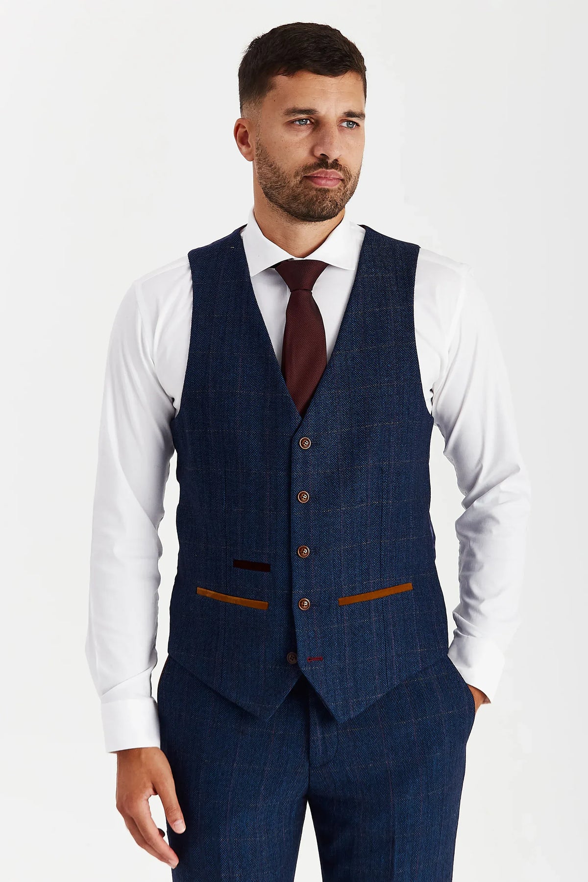 Front view of the Paul Andrew Scott Navy Tweed Check men’s waistcoat from Menz Suits Stockport, featuring subtle check fabric, brown buttons, and tan detailing.