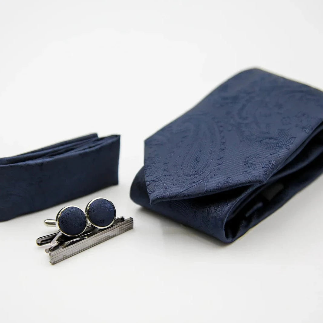 Paul Andrew navy blue tie, pocket square, and cufflinks on a white background