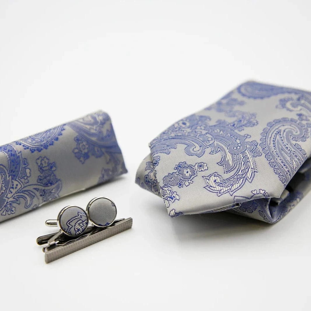 Paul Andrew blue and silver paisley tie, cufflinks, and tie clip on a white background