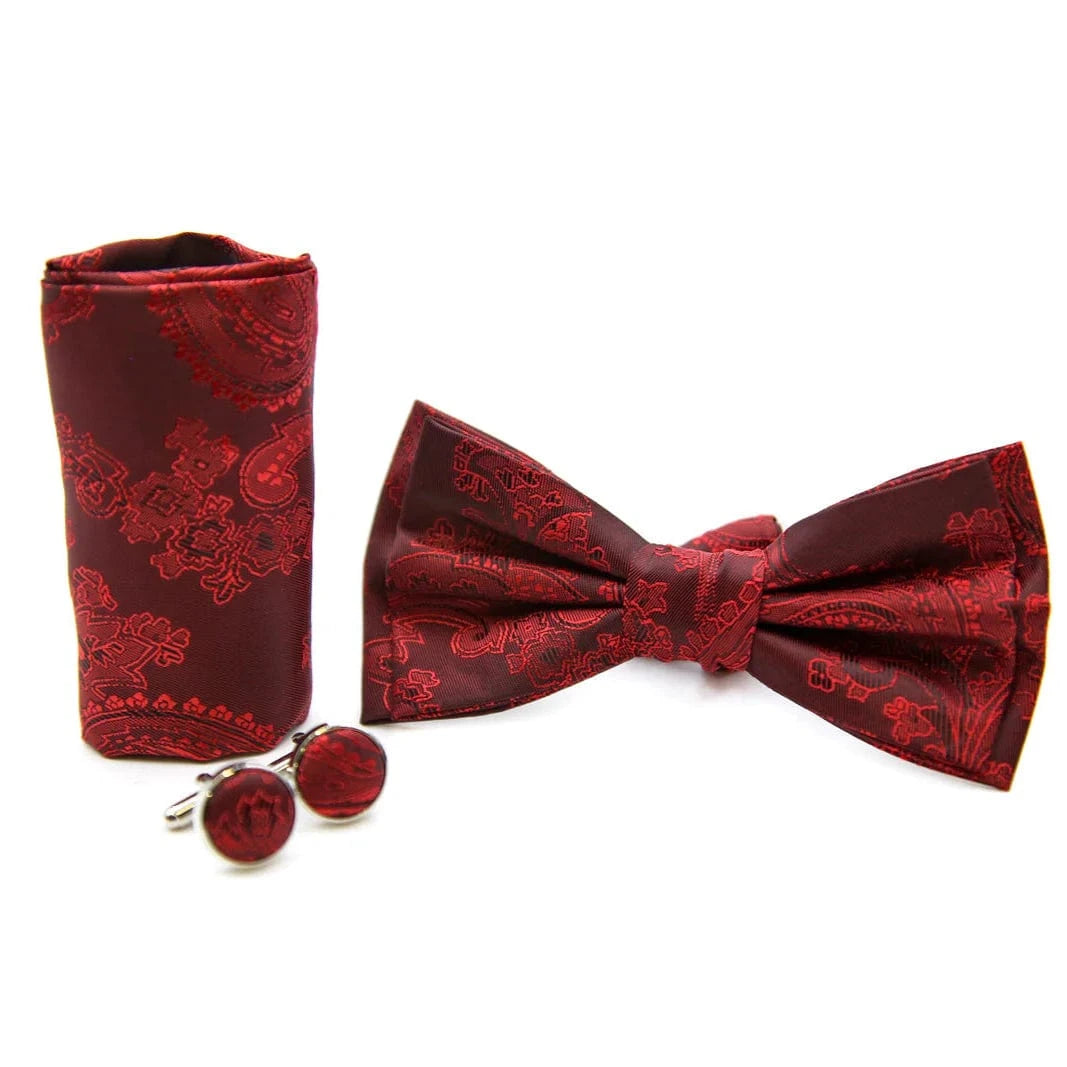 Paul Andrew red bow tie, pocket square, and cufflinks set on a white background
