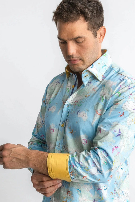 Man wearing a Claudio Lugli light blue flight map patterned shirt against a white background.