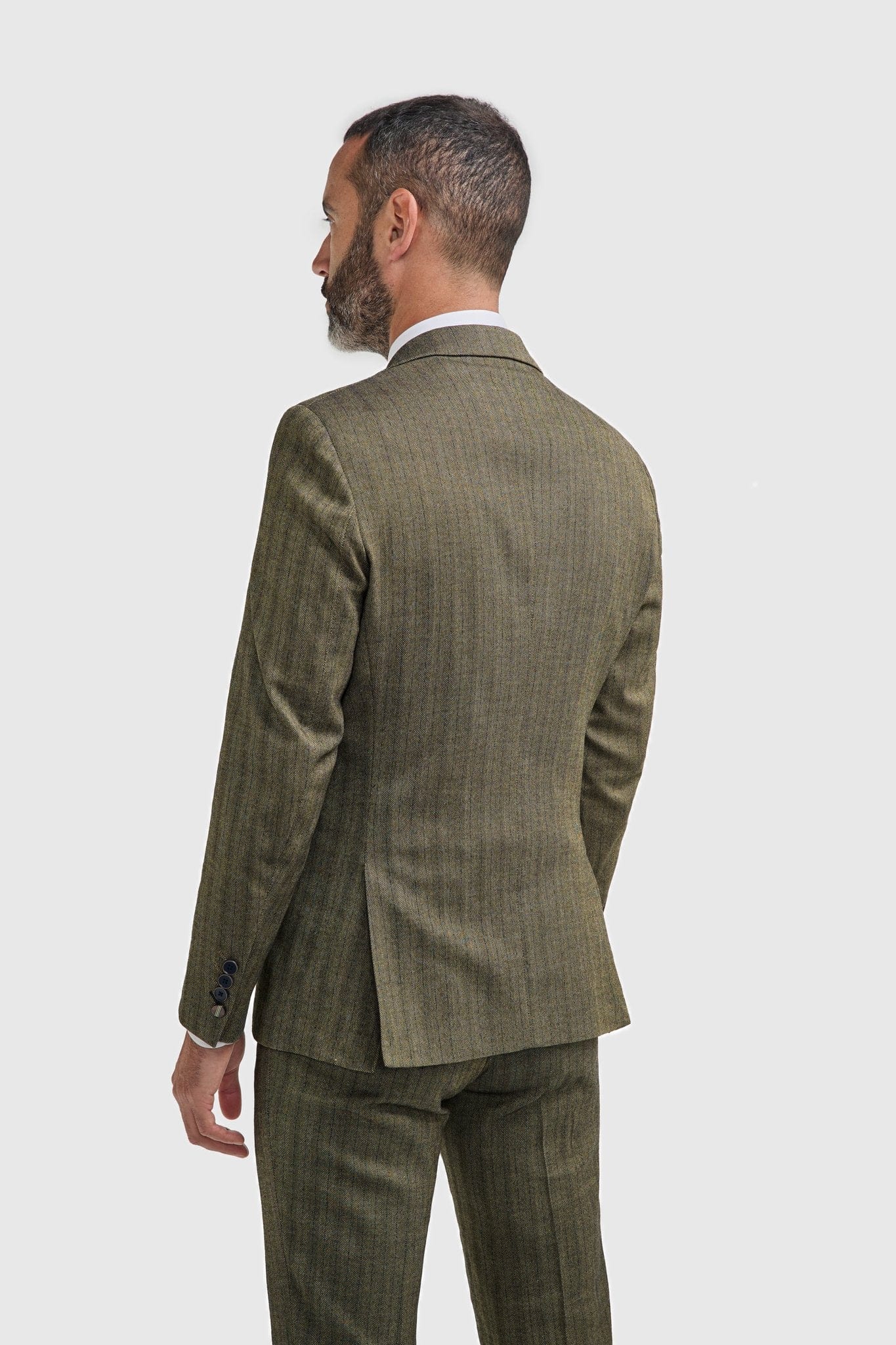 Man wearing a Cavani Damon sage tweed suit on a white background