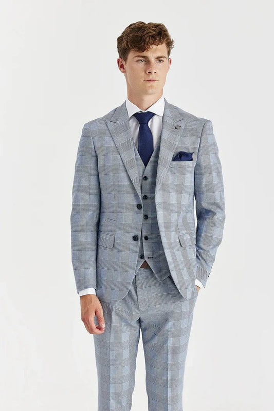 Man wearing a Paul Andrew sky blue checkered suit with a white shirt and black shoes on a white background