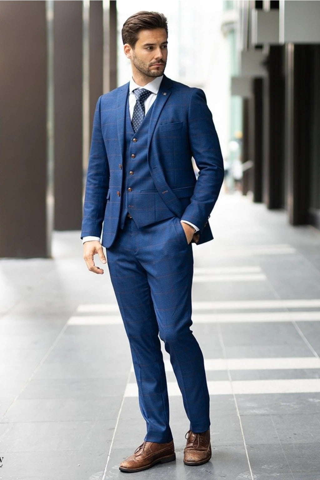 A man wearing a Paul Andrew Alex Blue  three-piece suit Ideal for formal occasions and weddings. 