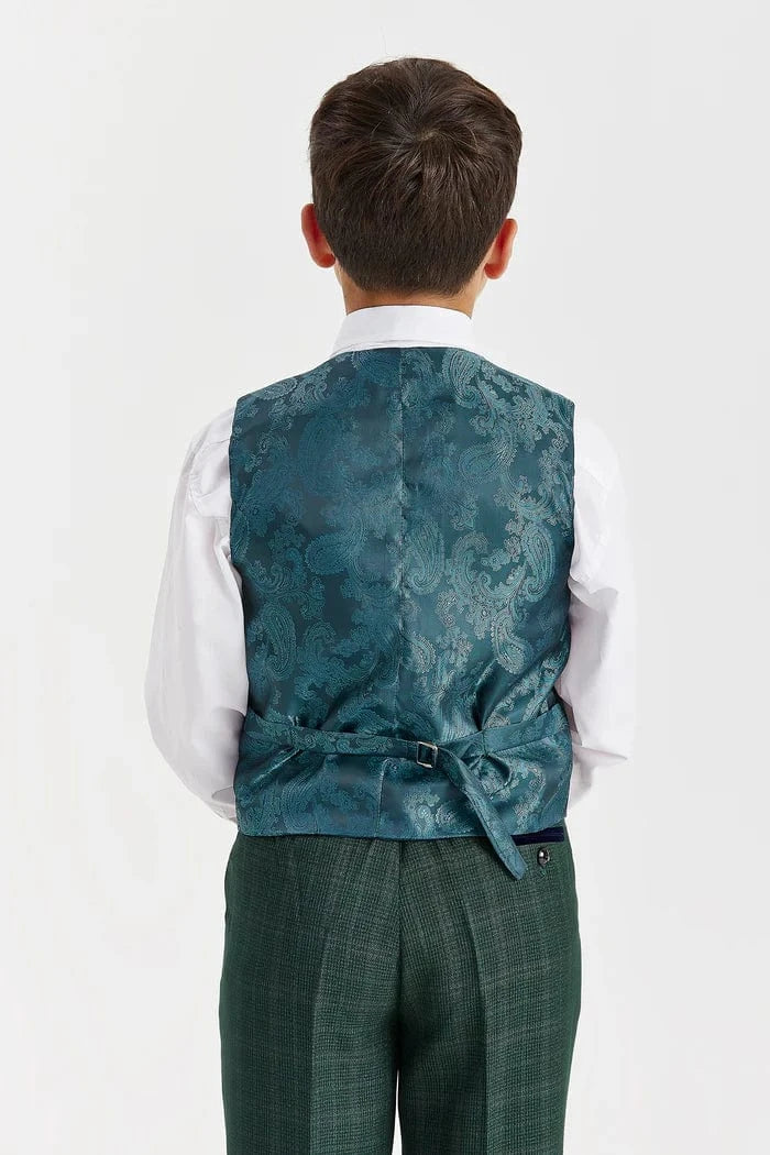 Child wearing a teal patterned vest over a white shirt on a light gray background