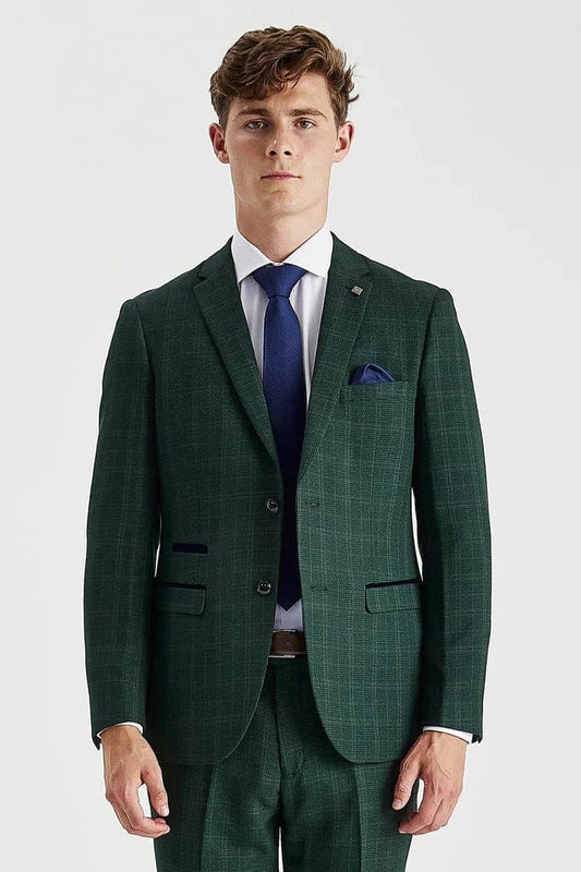Man wearing a green checkered suit with a blue tie on a white background