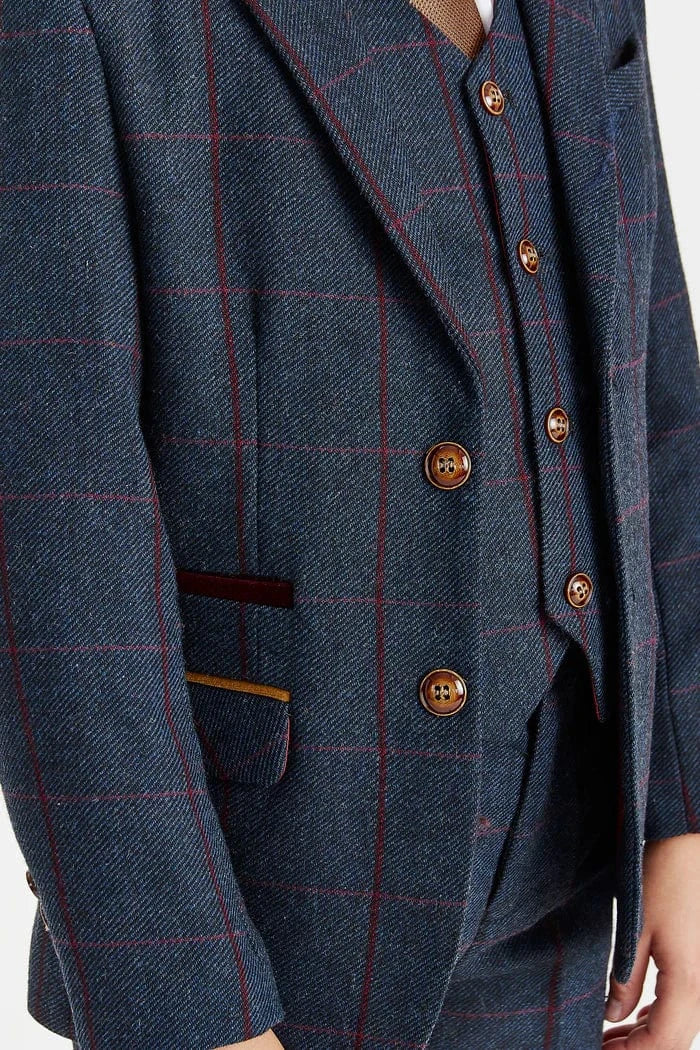 Close-up of a navycheckered blazer with brass buttons