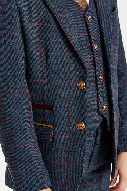 Close-up of a navycheckered blazer with brass buttons