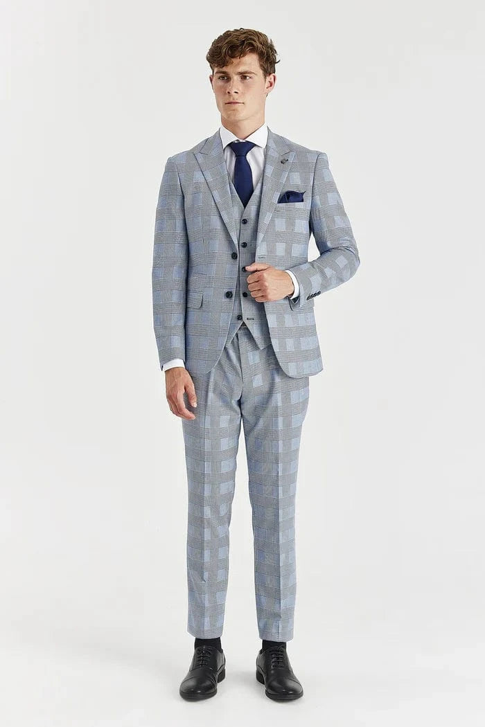 Man wearing a Paul Andrew sky blue checkered suit with a white shirt and black shoes on a white background