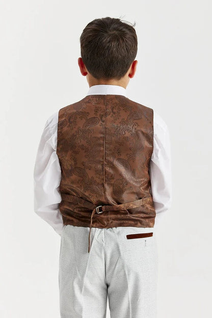 Child wearing a brown leather vest on a white background