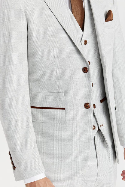 Stone checkered suit with brown buttons and trim on a neutral background