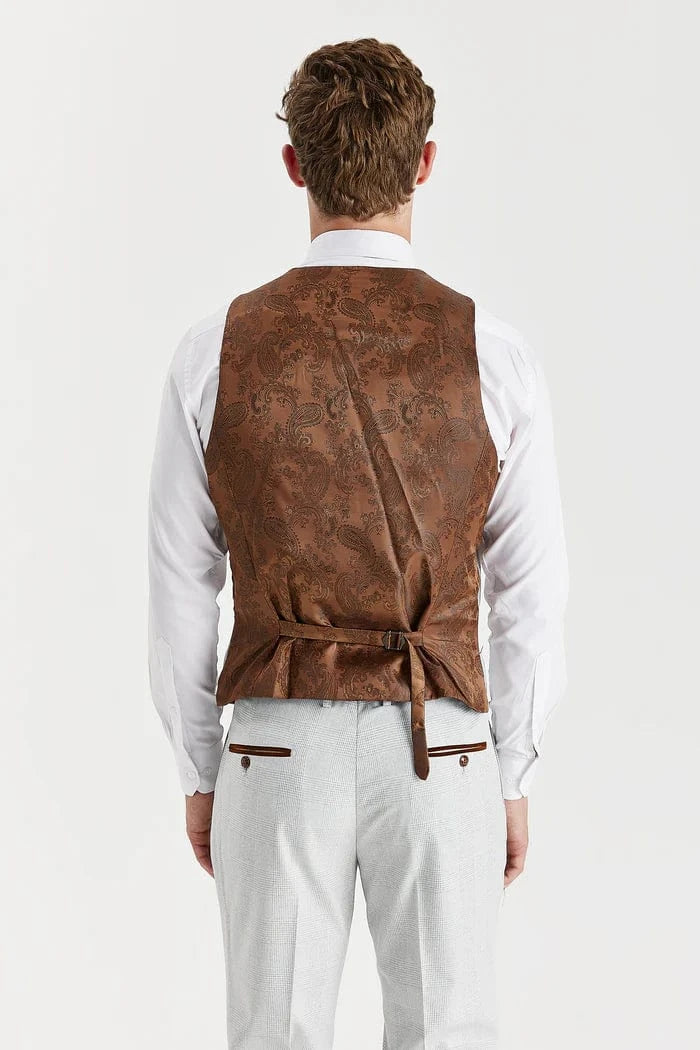 Man wearing a brown vest over a white shirt on a white background