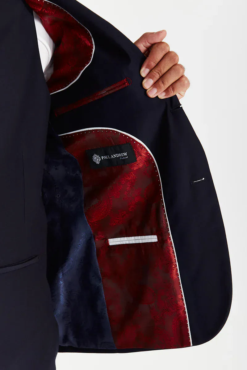Inside view of the Paul Andrew Parker Navy Three Piece men’s suit jacket from Menz Suits Stockport, featuring double panel paisley lining in navy and red with detailed stitching.