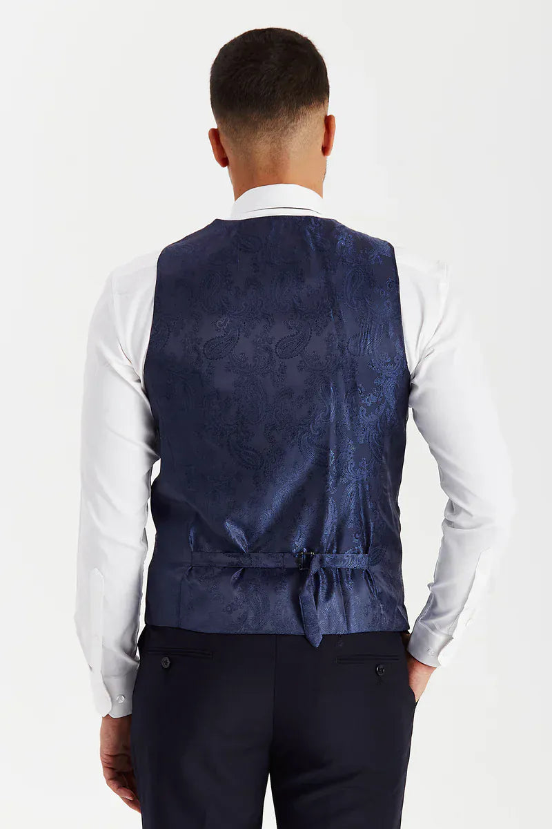 Rear view of the Paul Andrew Parker Navy men’s waistcoat from Menz Suits Stockport, showing adjustable back strap and deep navy paisley finish.