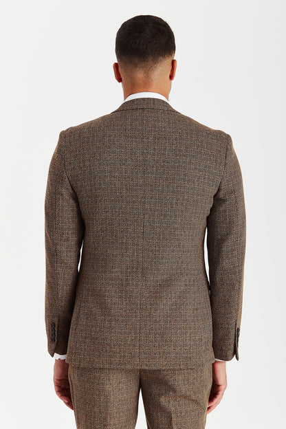 Rear view of a male model wearing the Paul Andrew Ralph Brown Tweed 1920s Style men’s suit from Menz Suits Stockport, highlighting double vents and classic tweed pattern.
