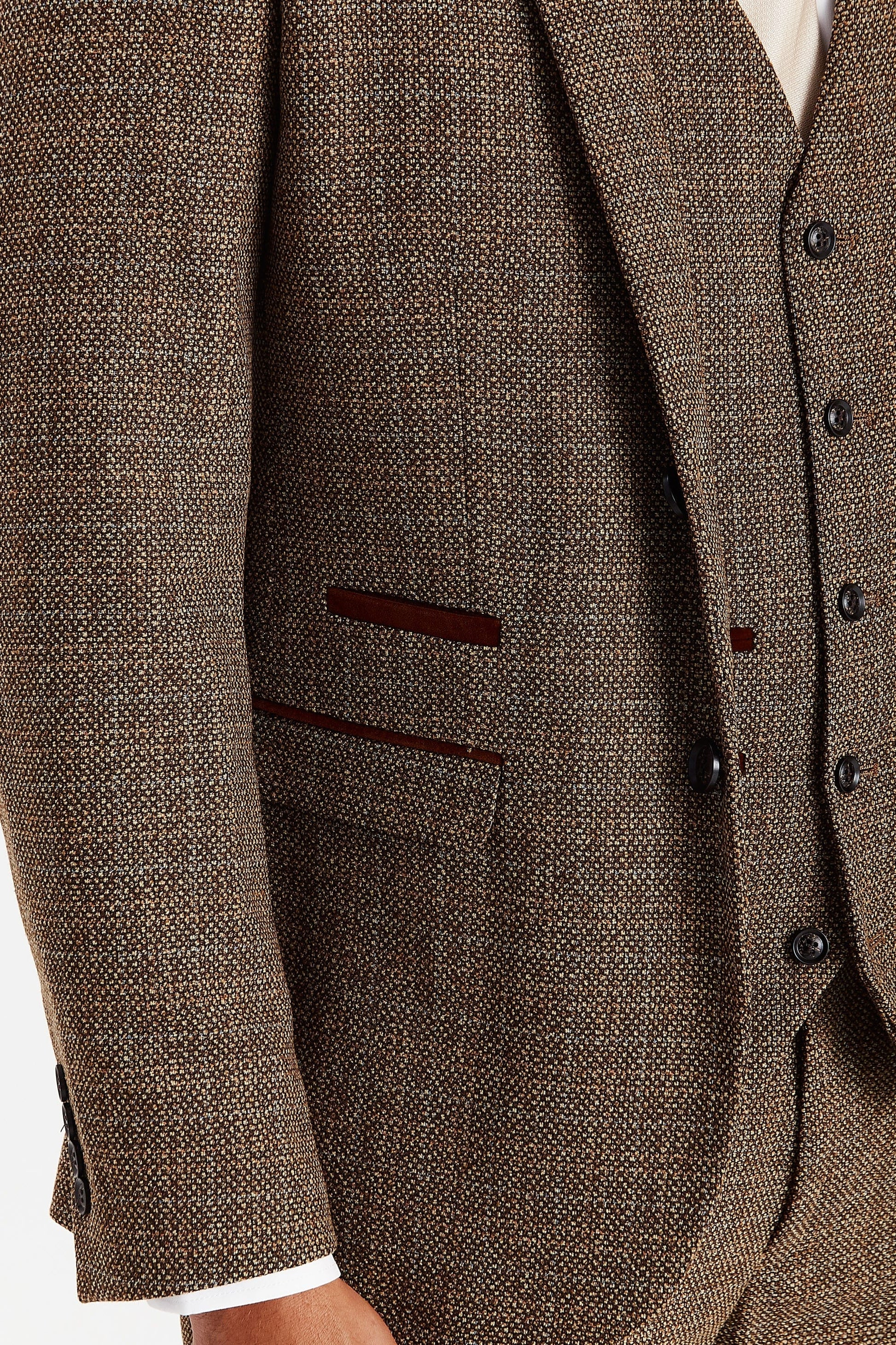 Close-up of the Paul Andrew Ralph Brown Tweed 1920s Style Three Piece Suit jacket from Menz Suits Stockport, showing brown buttons, suede trim, and detailed tweed fabric.