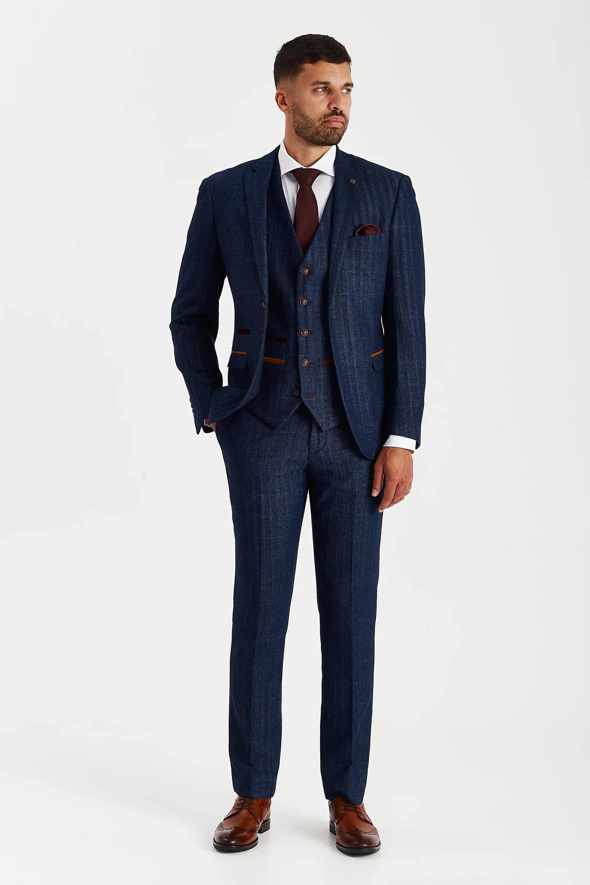 Male model wearing the Paul Andrew Scott Navy Tweed Check Three Piece men’s suit from Menz Suits Stockport, featuring navy tweed fabric and tailored fit design.