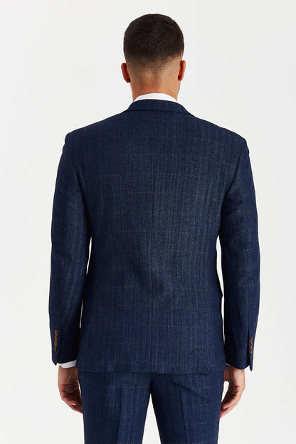 Rear view of a male model wearing the Paul Andrew Scott Navy Tweed Check Three Piece men’s suit from Menz Suits Stockport, highlighting double vents and classic tweed texture.