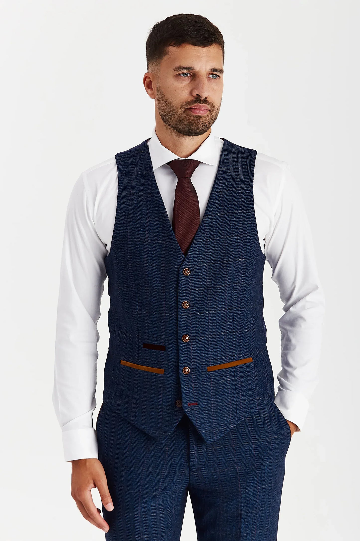 Front view of the Paul Andrew Scott Navy Tweed Check men’s waistcoat from Menz Suits Stockport, featuring subtle check fabric, brown buttons, and tan detailing.