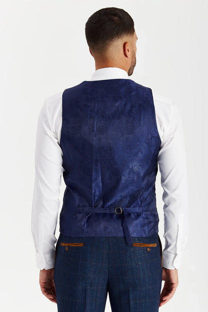 Rear view of the Paul Andrew Scott Navy Tweed Check men’s waistcoat from Menz Suits Stockport, showing adjustable back strap and blue paisley fabric.