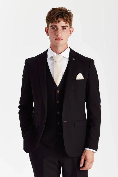 Close-up front view of a male model wearing the Paul Andrew Mayfair Black Three Piece men’s suit, showing tailored fit and brown button detailing.