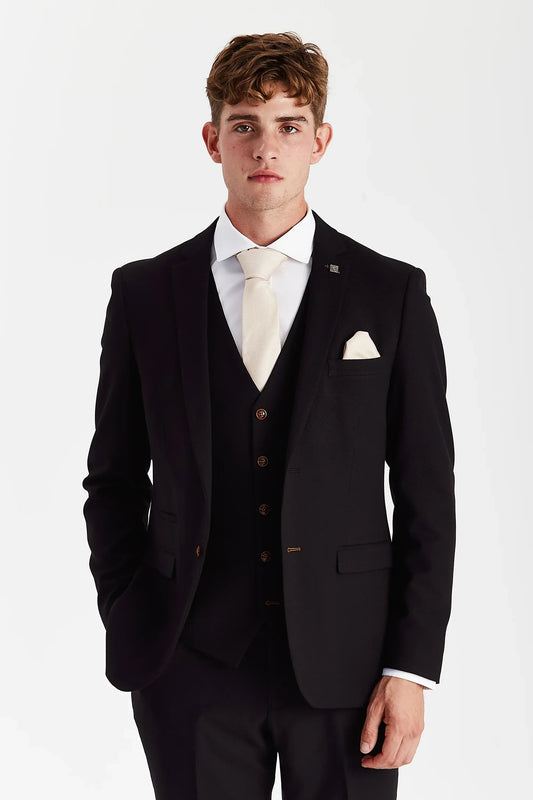 Close-up front view of a male model wearing the Paul Andrew Mayfair Black Three Piece men’s suit, showing tailored fit and brown button detailing.