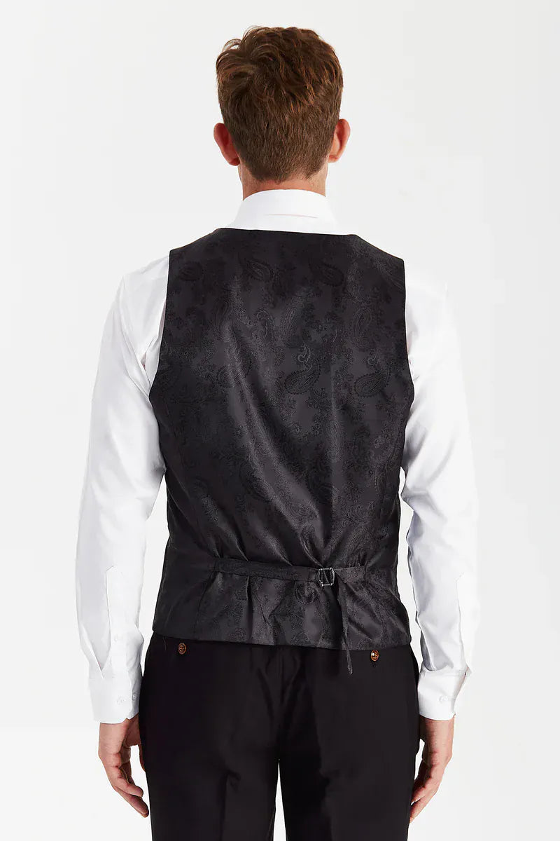 Rear view of the Paul Andrew Mayfair Black men’s waistcoat from Menz Suits Stockport, showing adjustable back strap and sleek black paisley finish.