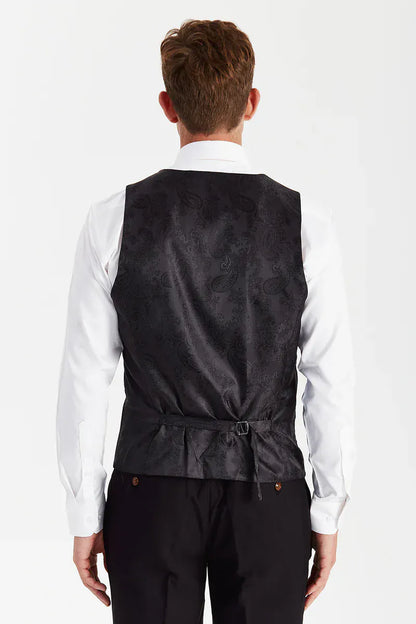 Rear view of the Paul Andrew Mayfair Black men’s waistcoat from Menz Suits Stockport, showing adjustable back strap and sleek black paisley finish.