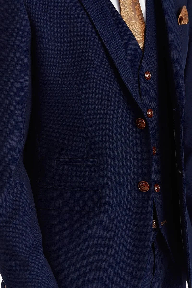 Close-up of the navy suit jacket showing the brown buttons and textured fabric