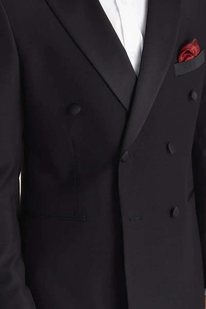 Close-up of the Paul Andrew Harry Black Double Breasted Tuxedo Suit from Menz Suits Stockport, focusing on satin peak lapel, button detail, and luxury black fabric.