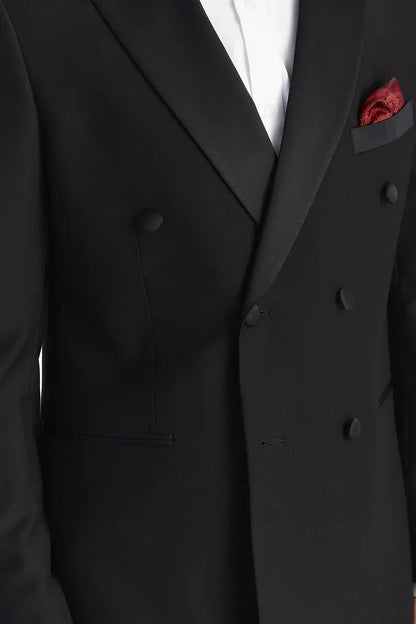 Close-up of the Paul Andrew Harry Black Double Breasted Tuxedo Suit from Menz Suits Stockport, focusing on satin peak lapel, button detail, and luxury black fabric.