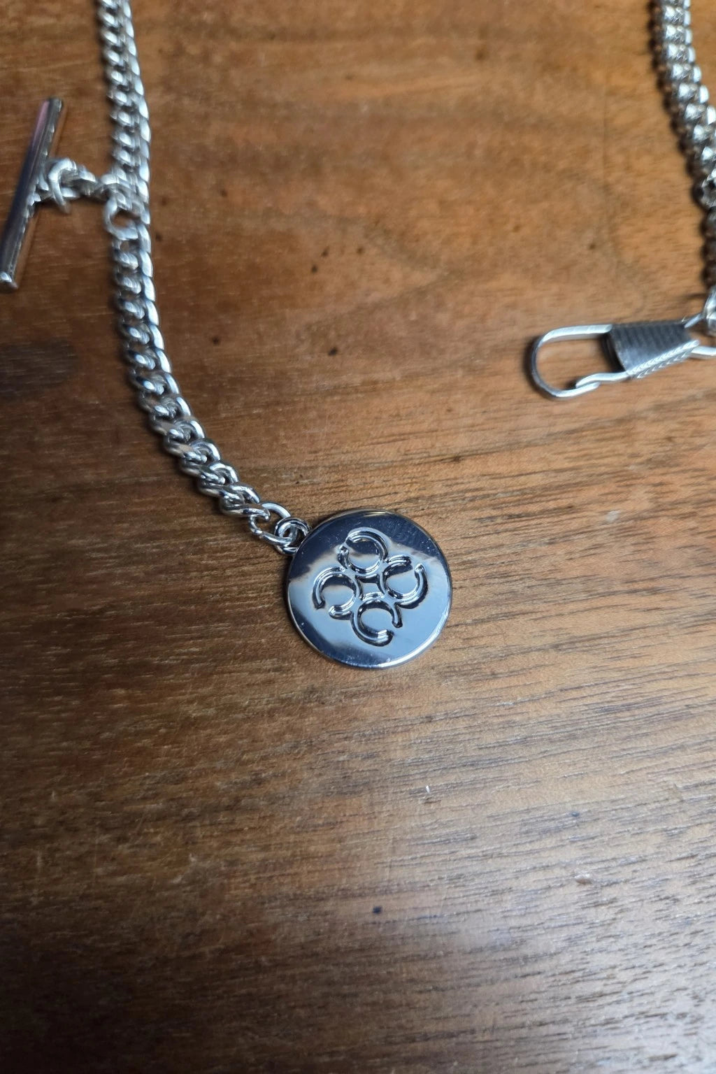 A closeup of the House Of Cavani T-bar waistcoat chain for weddings.