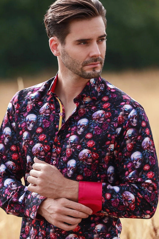 Man wearing a Claudio Lugli floral shirt with skull and flower pattern outdoors