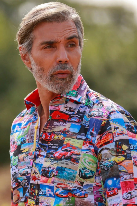 Man wearing a colorful Claudio Lugli Le Mans shirt with car patterns outdoors
