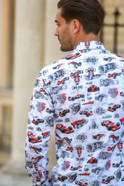 Man wearing a Claudio Lugli pit lane F1 shirt with Formula one car pattern standing outdoors.