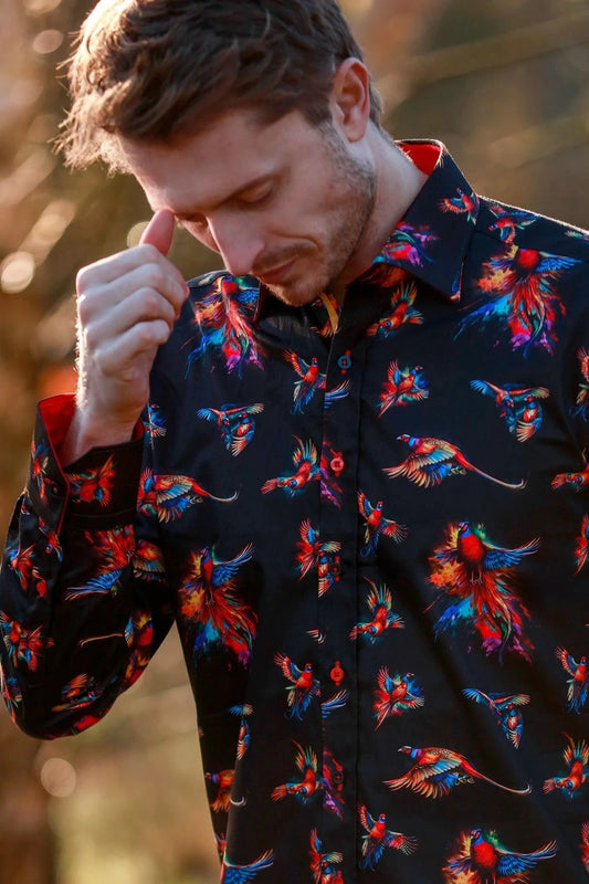 Man wearing a colorful Claudio Lugli  watercolour pheasant pattern shirt outdoors