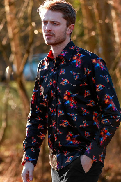 Man wearing a dark Claudio Lugli  shirt with watercolour pheasant pattern outdoors